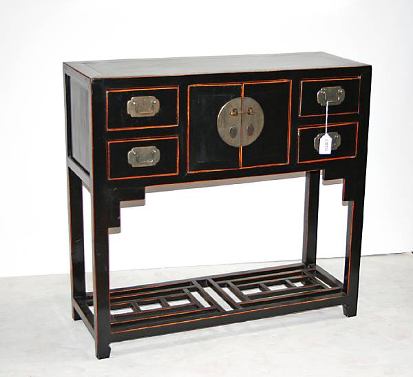 Appraisal: A Chinese black lacquered wood storage cabinet With lattice work