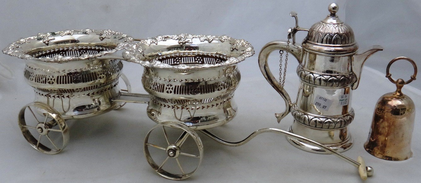 Appraisal: Plated wares comprising a wine bottle carriage fitted with two