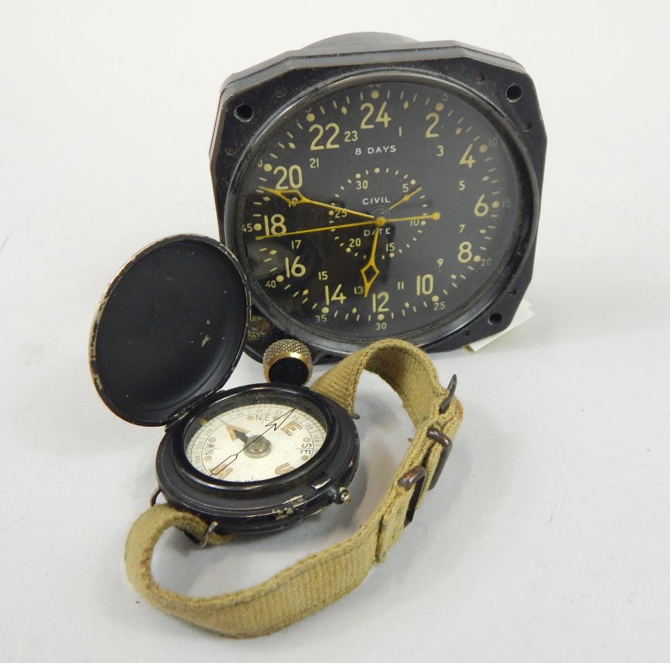 Appraisal: A mid thC aeronautical eight day aeroplane clock dial cm