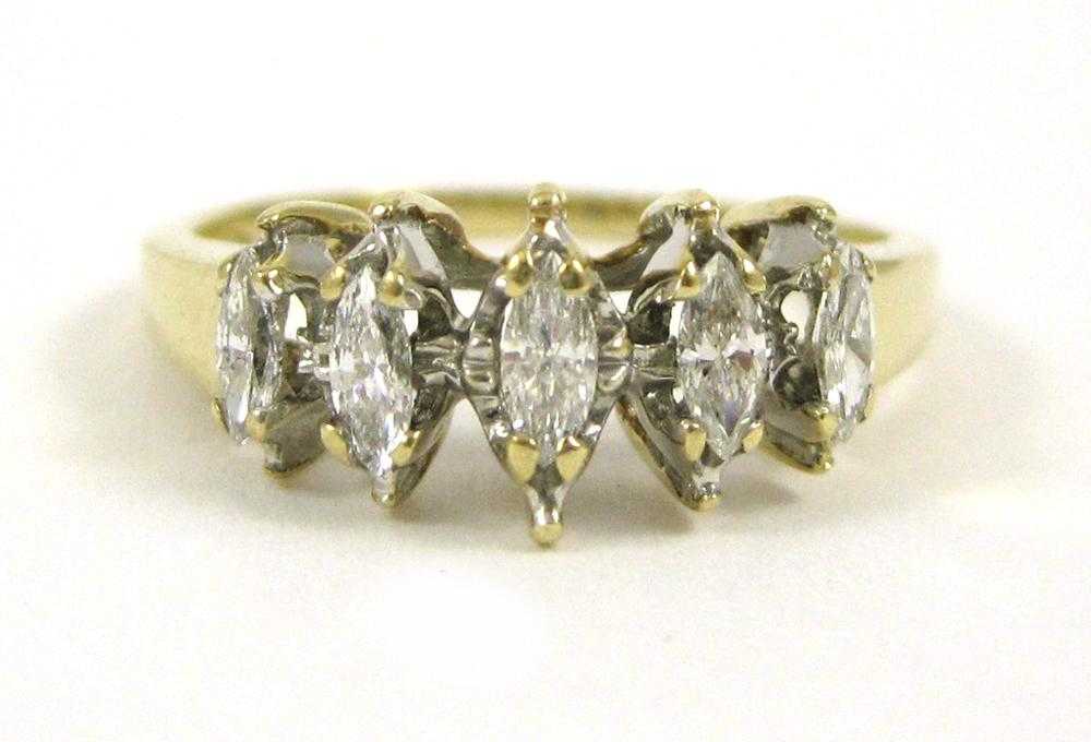 Appraisal: DIAMOND AND TEN KARAT GOLD RING set with five marquise-cut