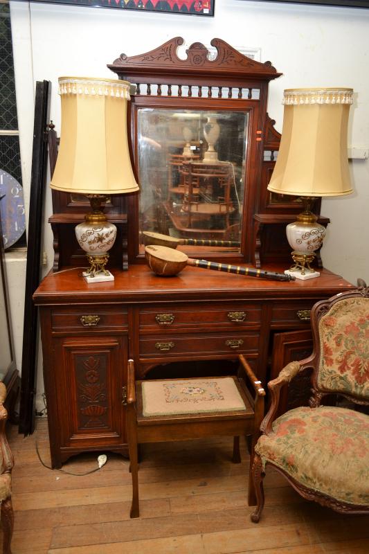 Appraisal: AN EDWARDIAN CEDAR MIRROR BACKED SIDEBOARD WITH CARVED DETAIL FEATURING