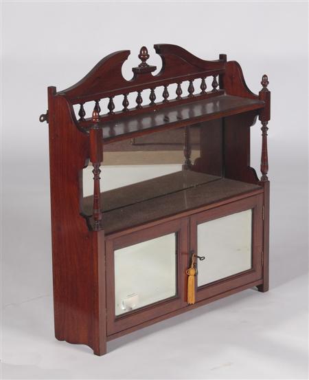 Appraisal: A set of mahogany hanging shelves the broken pediment with