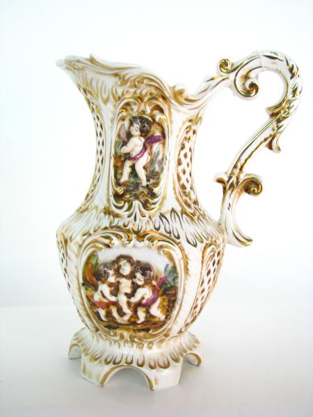 Appraisal: Capodimonte Porcelain Decorative Pitcher with embossed depictions of children and