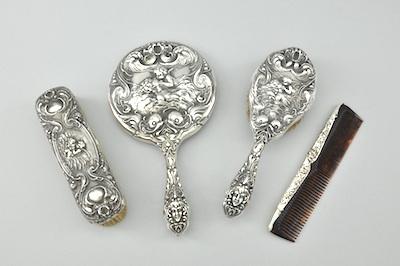 Appraisal: A Sterling Silver Loves Adorn Dresser Set Made by Unger