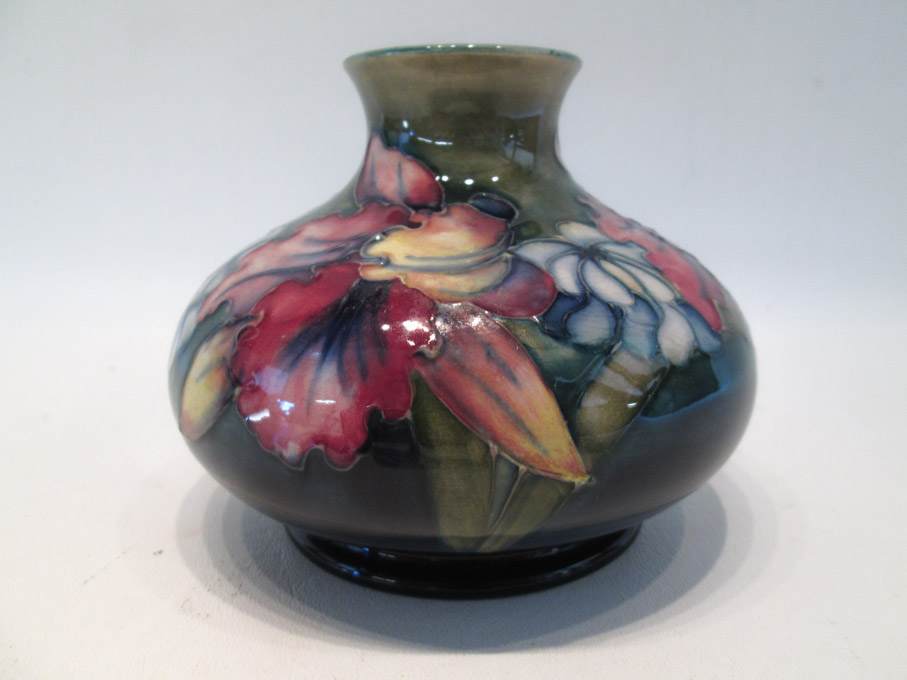 Appraisal: MOORCROFT ART POTTERY VASE hand painted under glaze with orchid