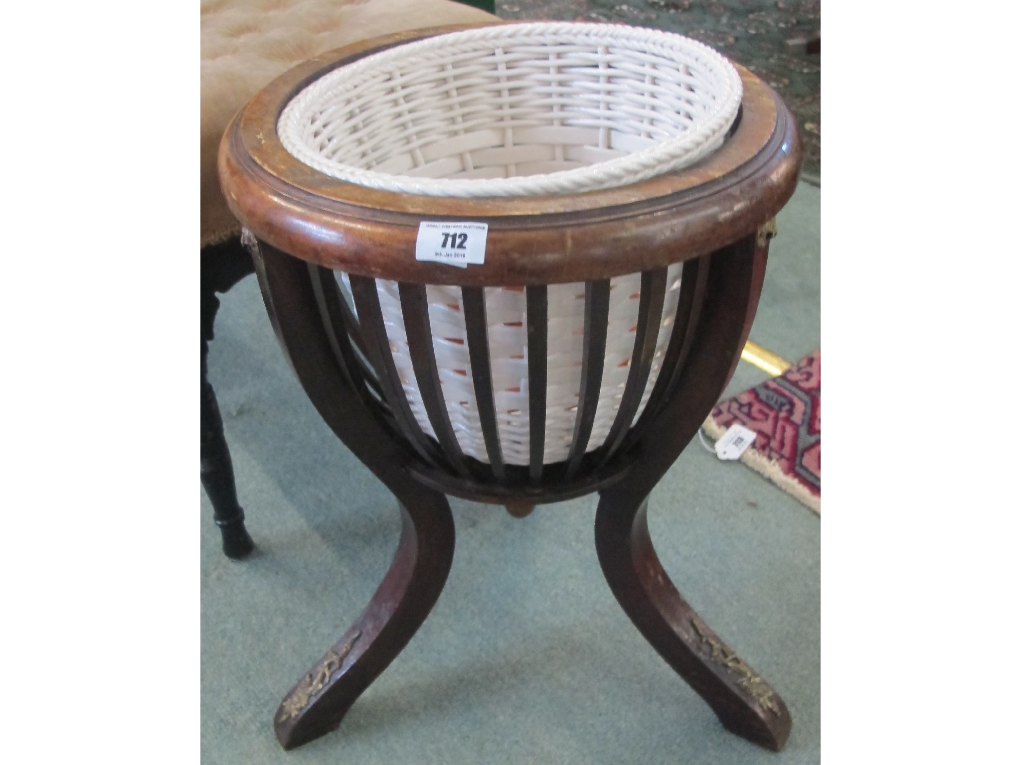 Appraisal: A contemporary mahogany plant stand with brass decoration