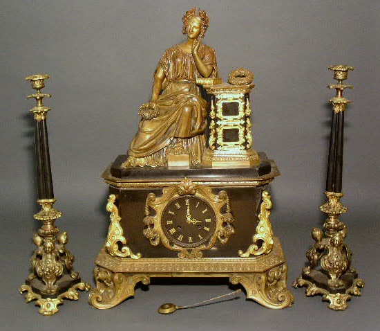 Appraisal: French gilt mantel clock with a seated classical figure and