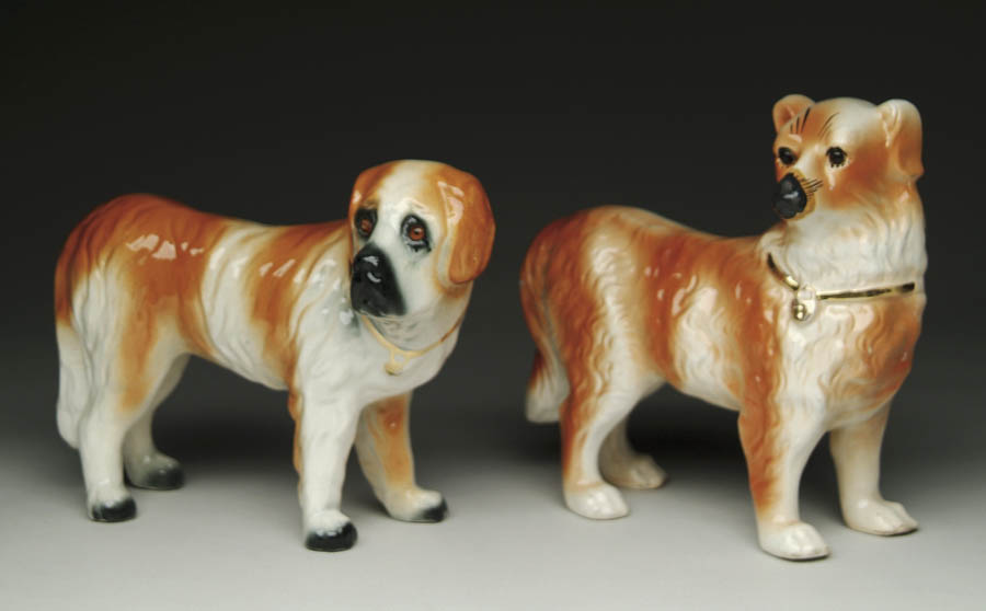 Appraisal: TWO STAFFORDSHIRE STANDING DOGS Both unmarked Brown and white dogs