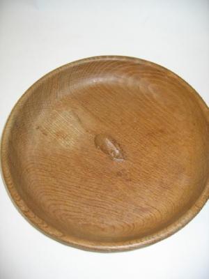 Appraisal: AN ADZED OAK FRUIT BOWL by Robert Mouseman Thompson of