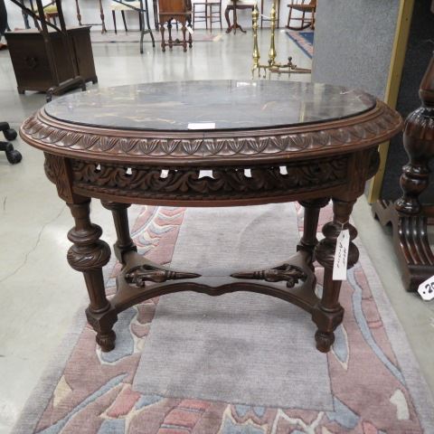 Appraisal: Italian Carved Walnut Table black marble oval