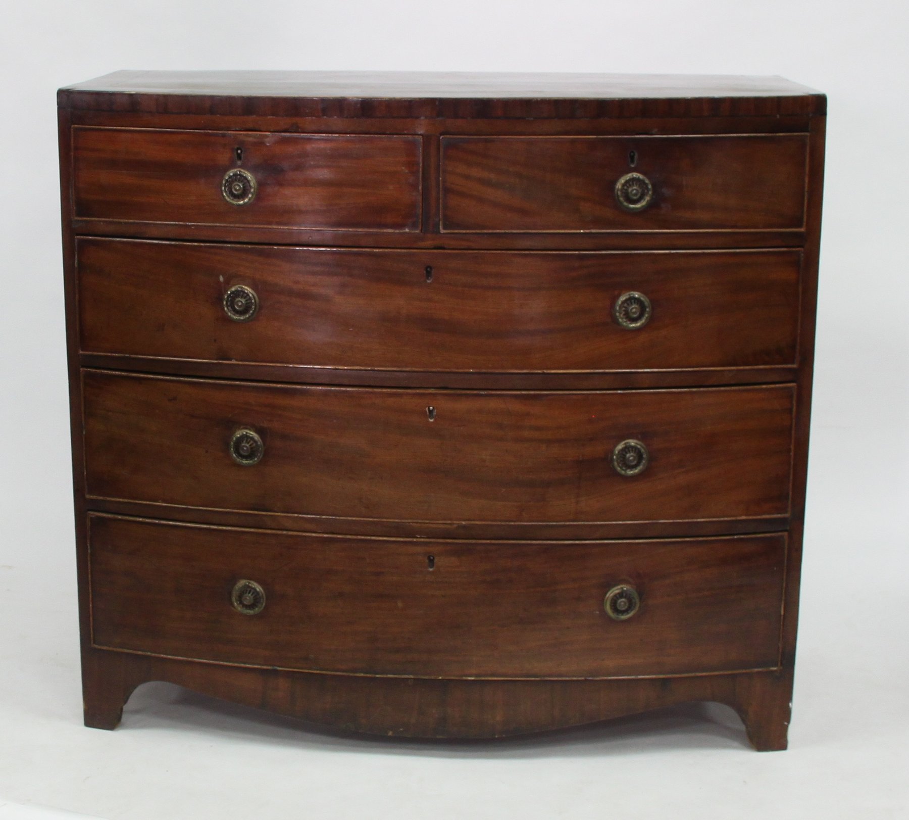 Appraisal: A th Century mahogany bowfront chest of two short over