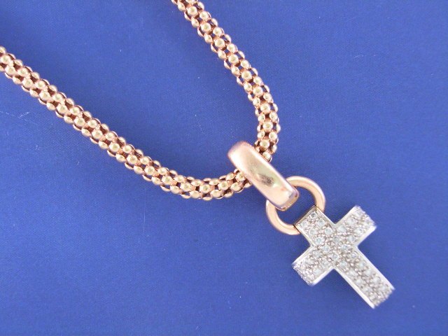 Appraisal: An ct white gold diamond set cross pendant on an