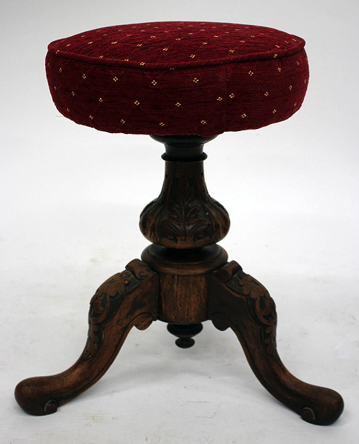 Appraisal: A VICTORIAN WALNUT CIRCULAR MUSIC STOOL with tripod base cm