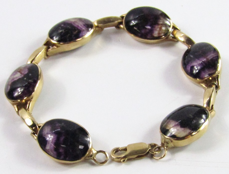 Appraisal: A ct gold bracelet with six oval links set with