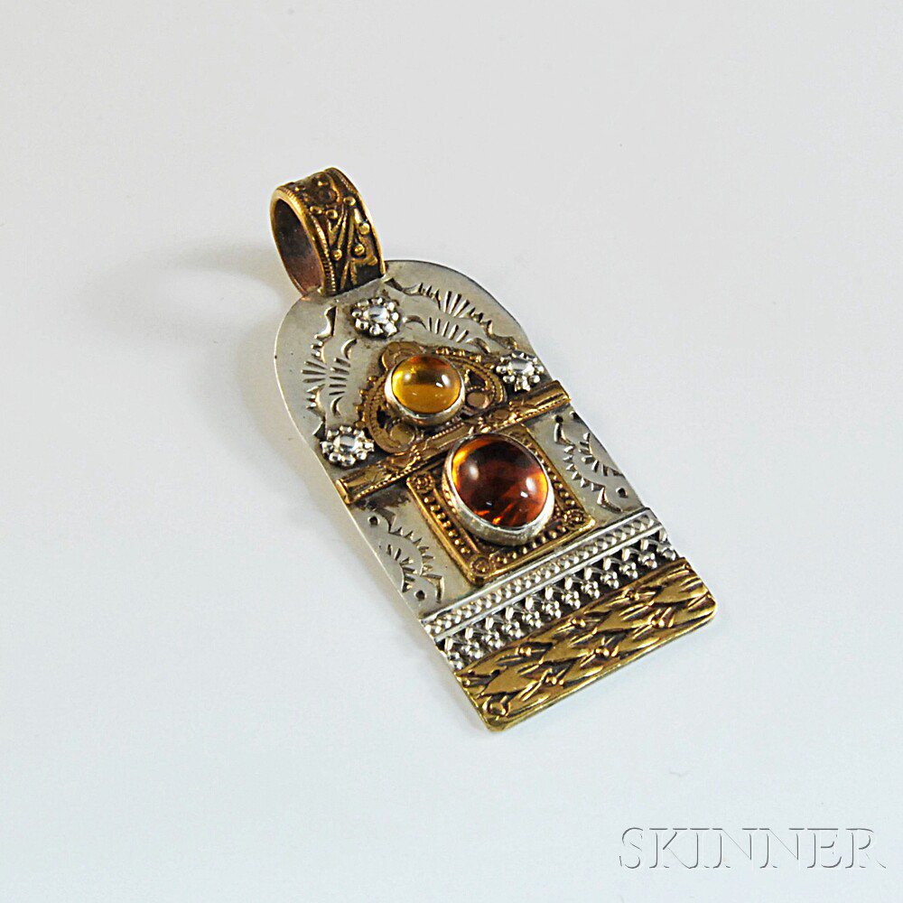 Appraisal: Sterling Silver and Amber Pendant with gilt accents set with