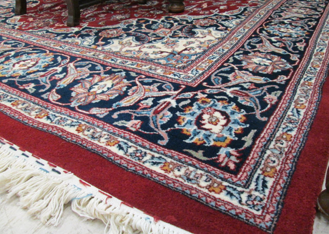 Appraisal: HAND KNOTTED ORIENTAL CARPET Indo-Persian floral and central floral medallion