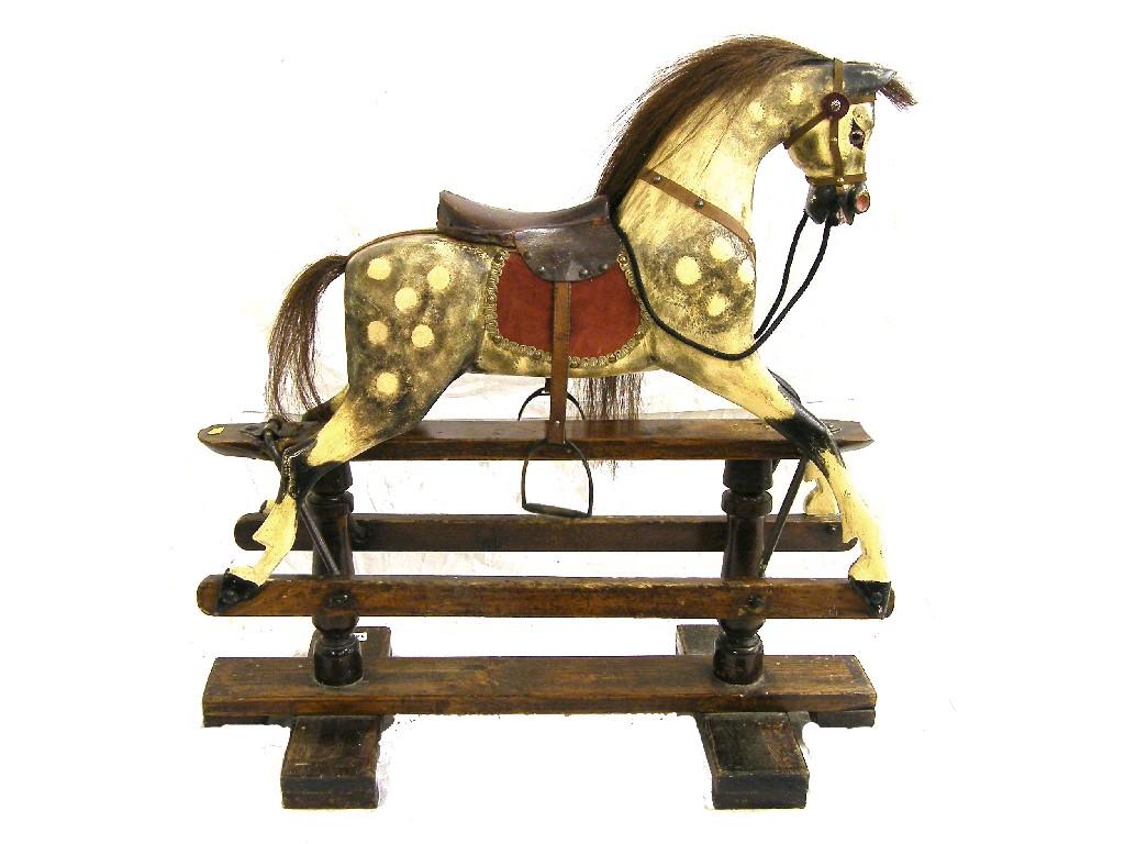 Appraisal: Grey dappled rocking horse by G J Lines with harnesses