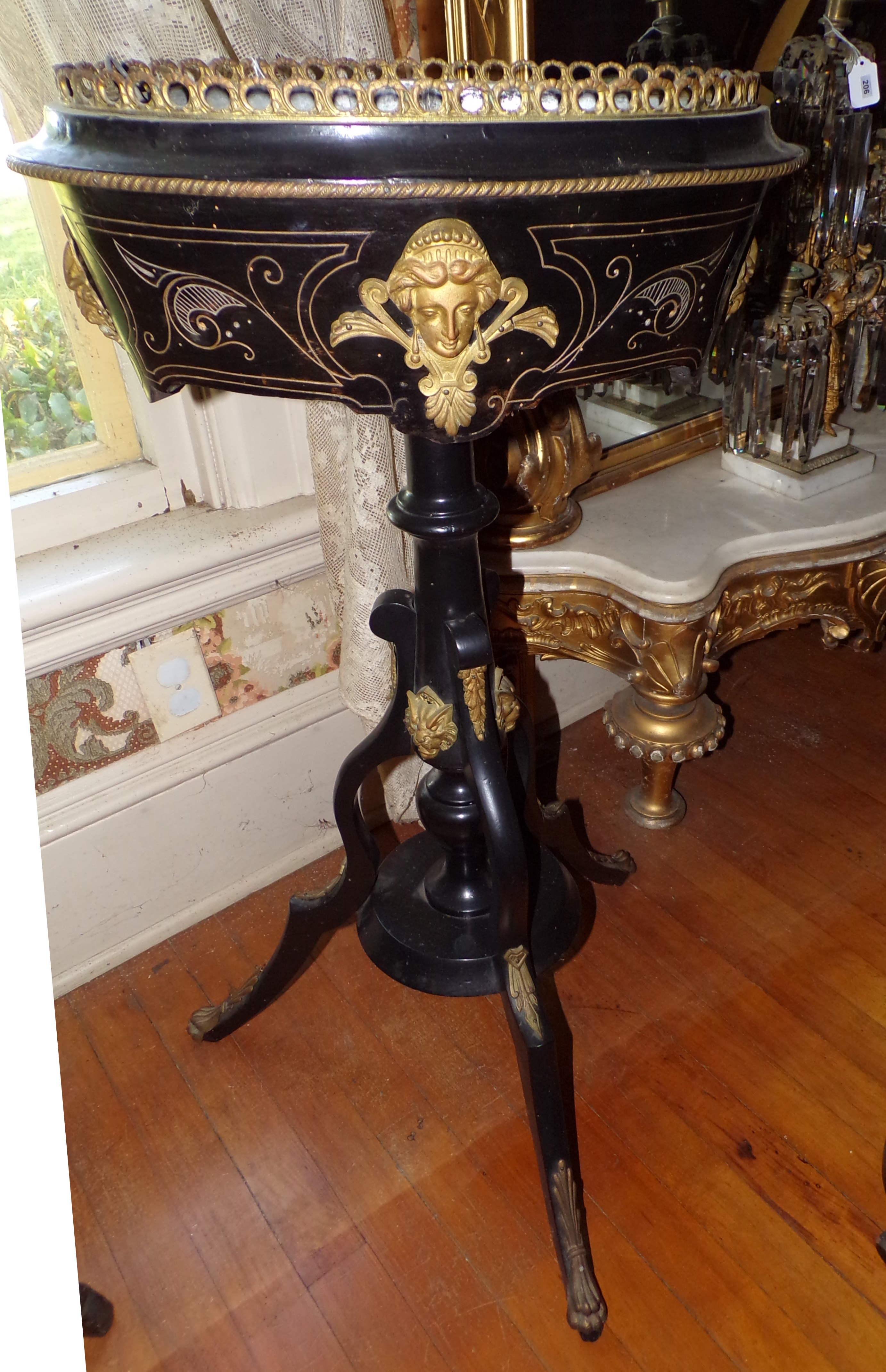 Appraisal: Black lacquer plant stand with brass mounts and incised gold