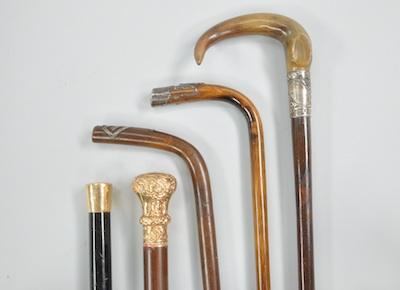 Appraisal: A Lot of Five Walking Sticks with Decorative Handles Lot