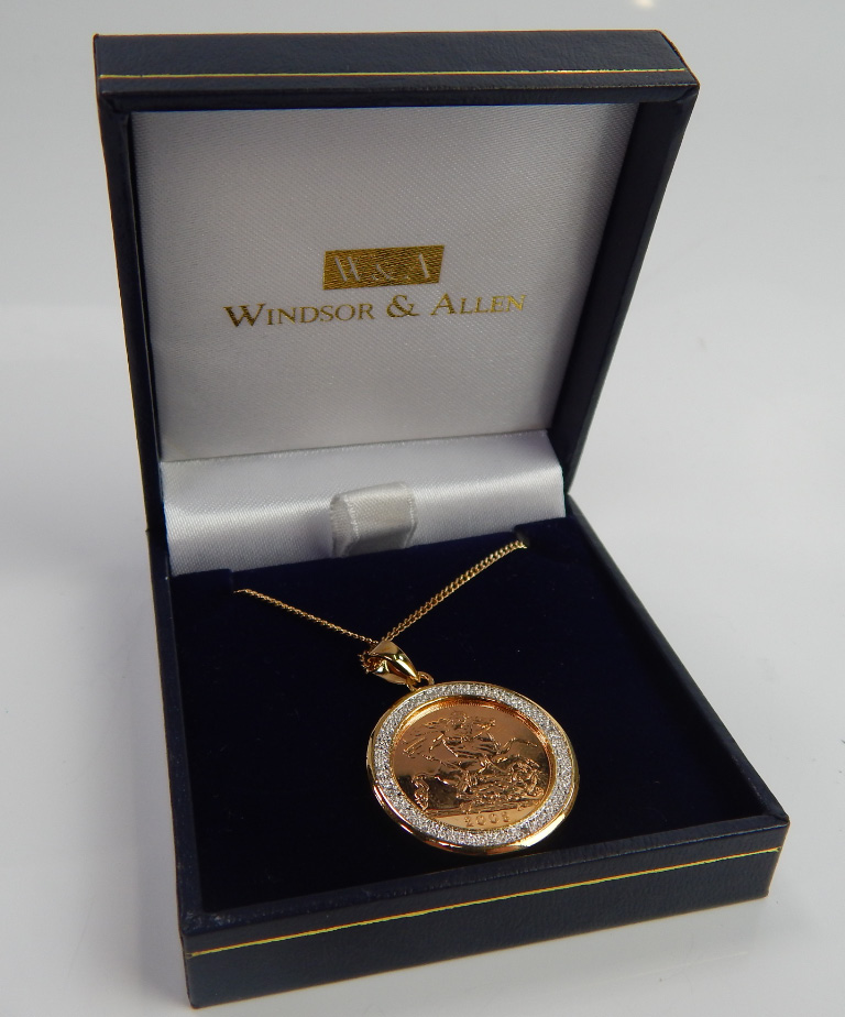 Appraisal: A sovereign pendant in extra frame and with plated chain