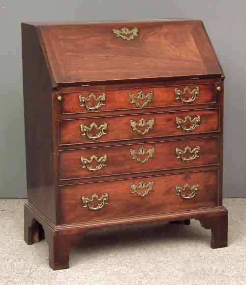 Appraisal: A good George II ''Cuban'' mahogany bureau of small proportions