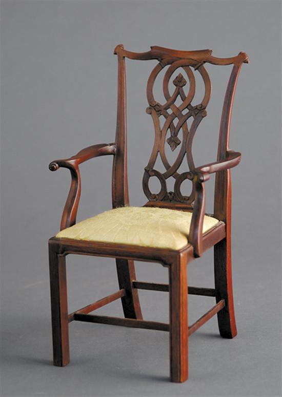 Appraisal: Chinese Chippendale style miniature armchair th centurycarved and shaped crest