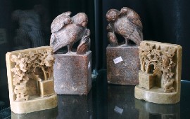 Appraisal: Two pairs of Chinese carved book ends one in soap