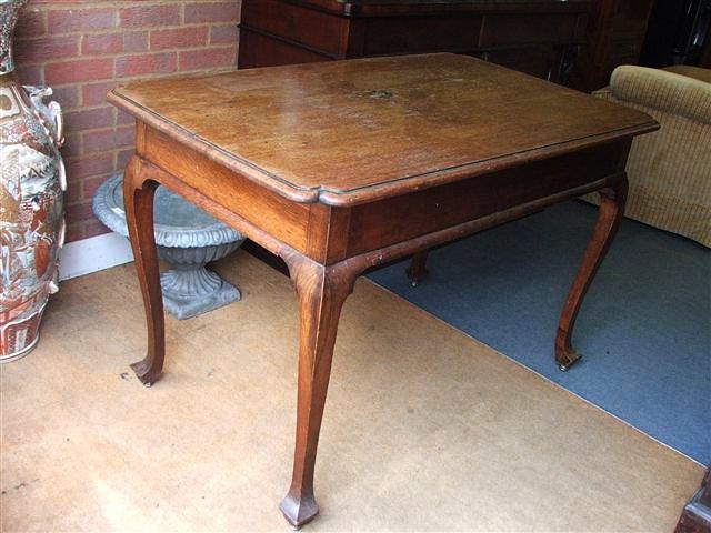 Appraisal: A FRENCH OAK WRITING TABLE on cabriole legs x