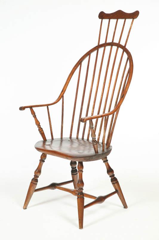 Appraisal: CONTINUOUS-BOW WINDSOR ARMCHAIR Rhode Island th century pine Peaked crest