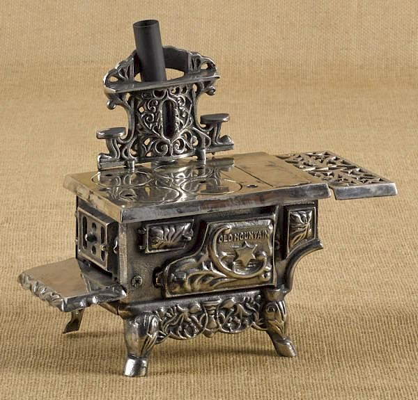 Appraisal: Cast iron and nickel Cold Mountain toy stove Cast iron