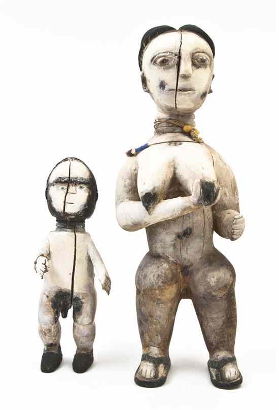 Appraisal: Two African Carved and Painted Figures depicting a male and