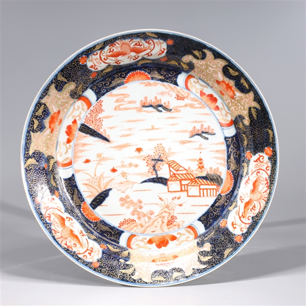 Appraisal: Chinese red and blue porcelain charger with gilt detail landscape