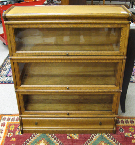 Appraisal: THREE-STACK OAK BOOKCASE American c Each of three horizontal stacking