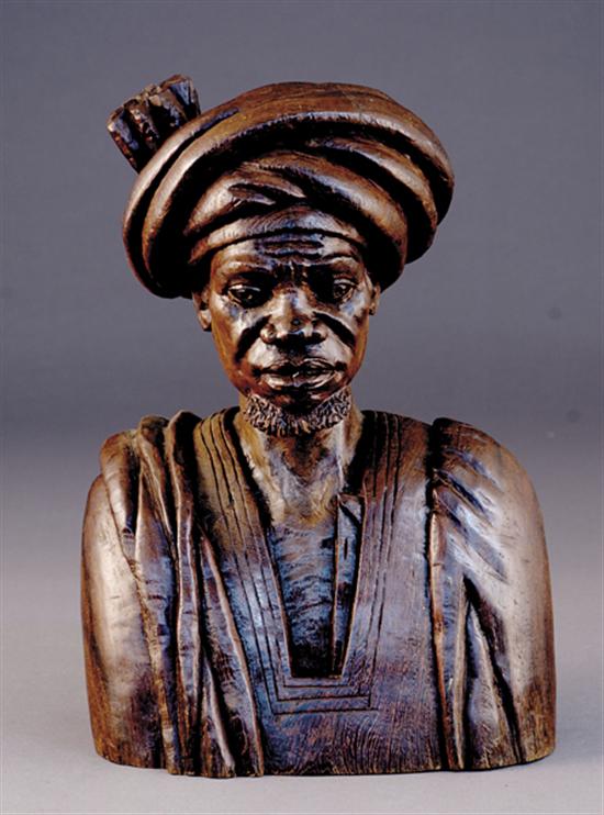 Appraisal: African school th century BUST OF NUBIAN MANcarved hardwood unsignedH