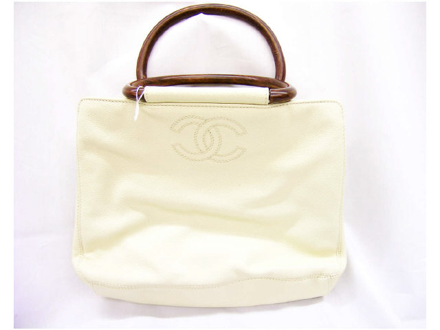 Appraisal: Chanel handbag ivory leather Classic Bag no flap with wooden