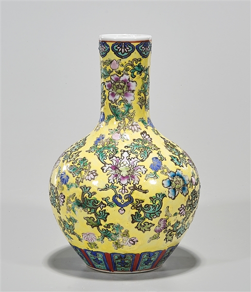 Appraisal: Chinese enameled porcelain vase floral design over yellow ground Qianlong