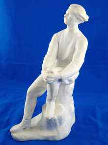 Appraisal: A Russian ceramic blanc de chine figure of Gorky resting