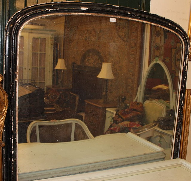 Appraisal: A LARGE VICTORIAN OVER MANTLE MIRROR with a black painted