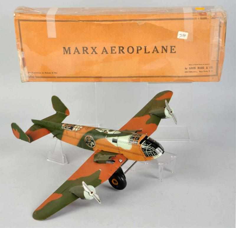 Appraisal: Tin Litho Marx Aeroplane Wind-Up Toy American Working Camouflage military