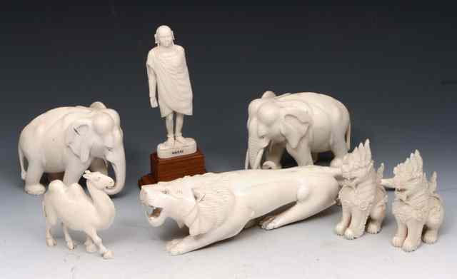 Appraisal: A GROUP OF CARVED IVORY to include a Masai warrior