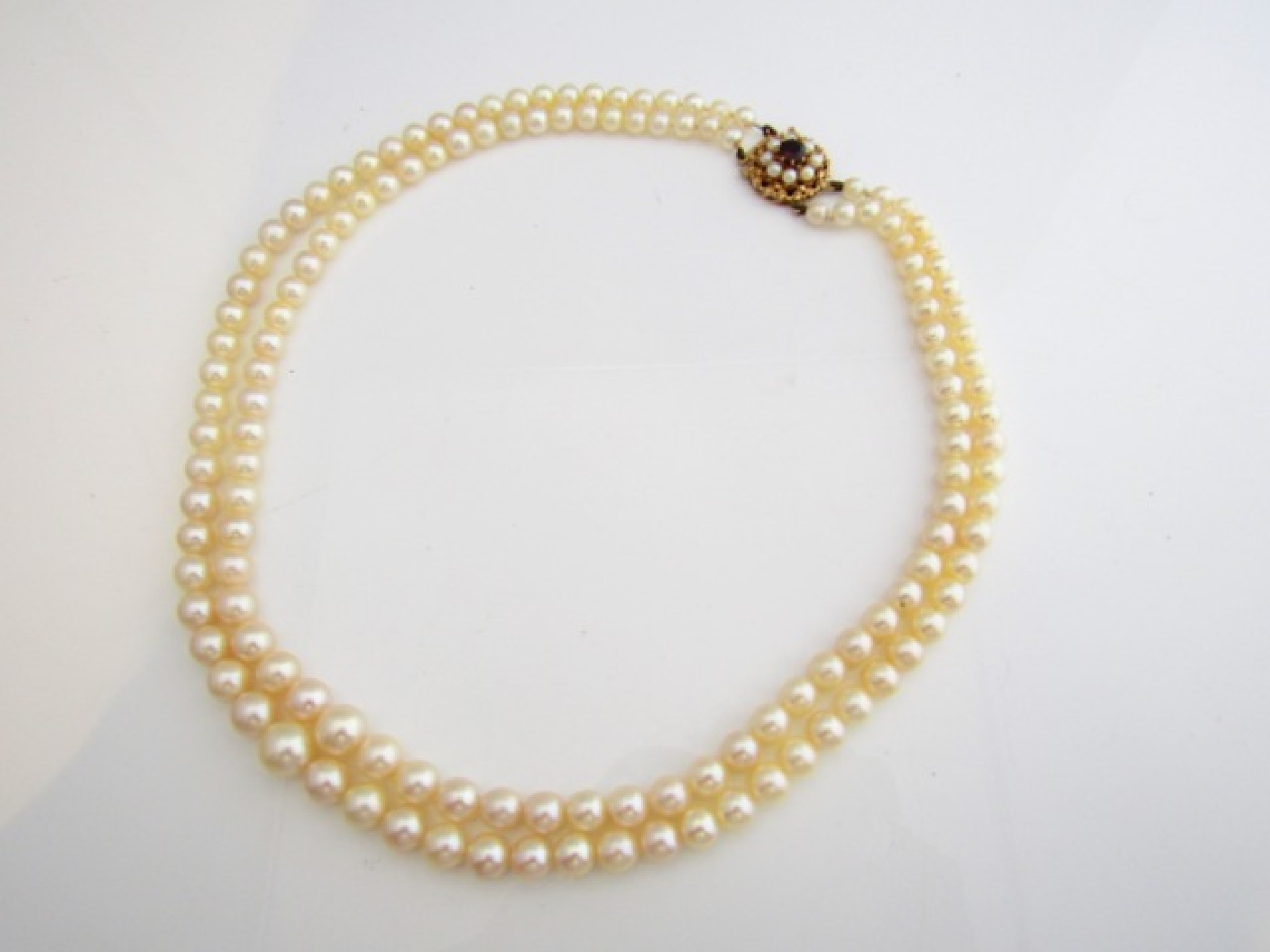 Appraisal: A graduated double-strand pearl necklace comprising a strand of sixty-seven