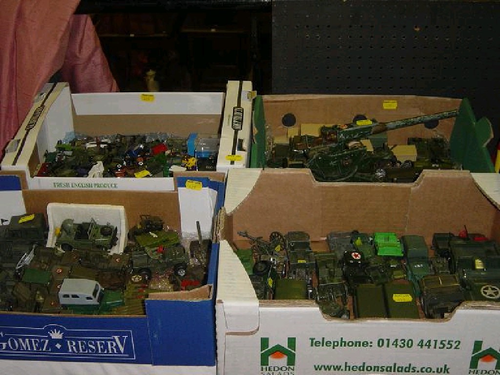 Appraisal: Four boxes of toy military vehicles mainly jeeps and heavy