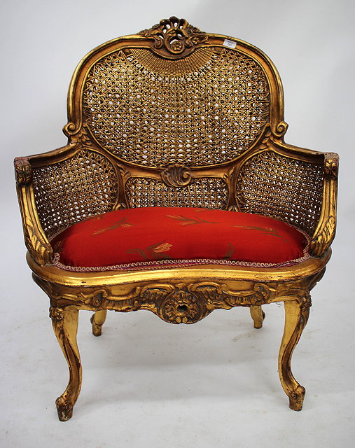 Appraisal: A LARGE CONTINENTAL GILT BERGERE ARMCHAIR with inset upholstered kidney