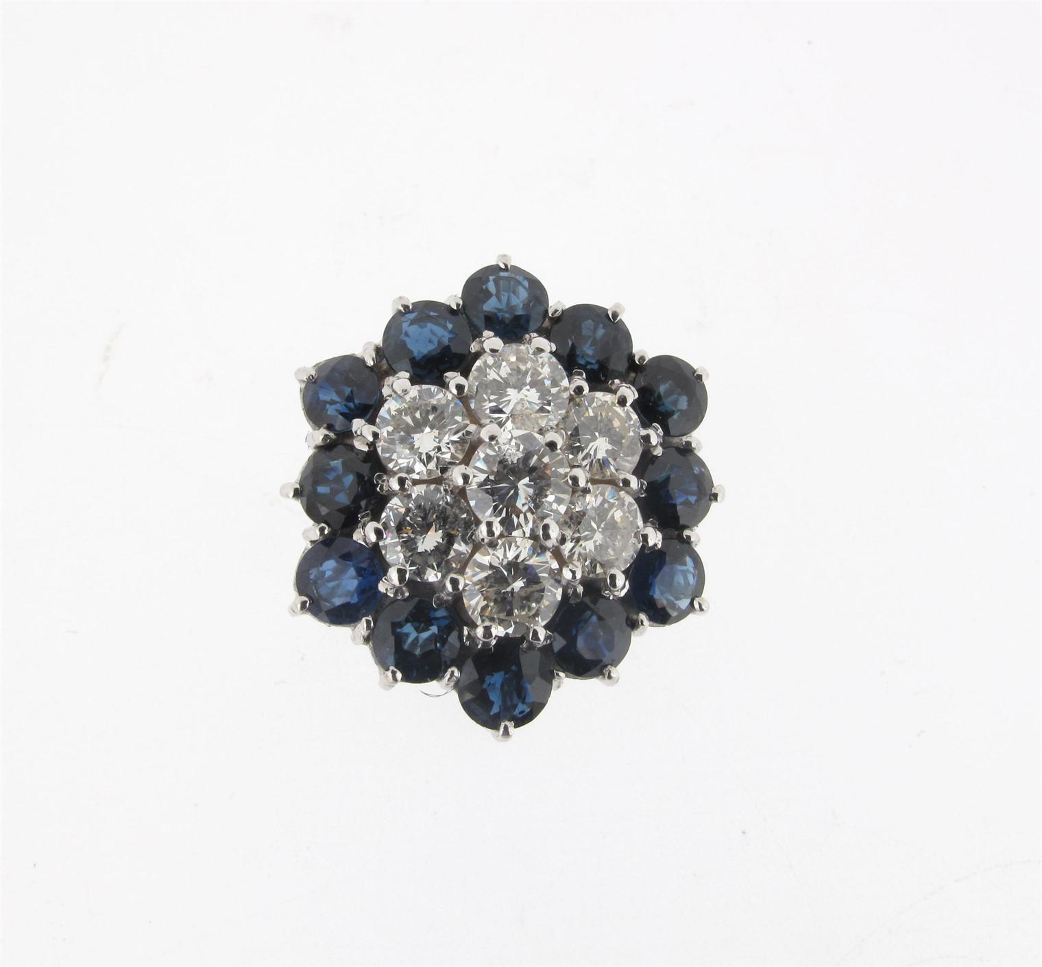 Appraisal: A diamond and sapphire cluster ring