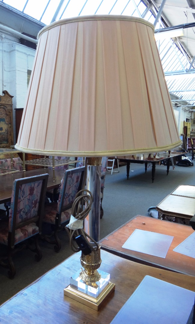 Appraisal: A pair of modern perspex and gilt metal mounted table