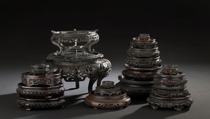 Appraisal: Group of Nineteen Chinese Carved Wooden Display Stands including vase