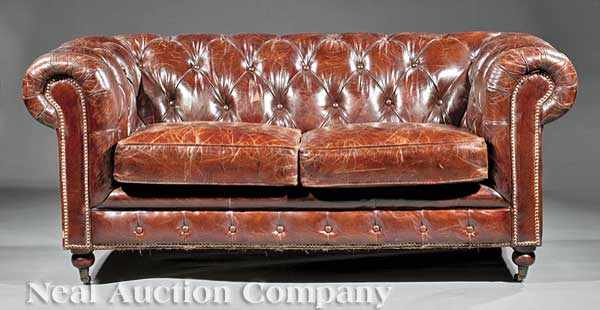 Appraisal: A Chesterfield Settee of typical form with tufted back and