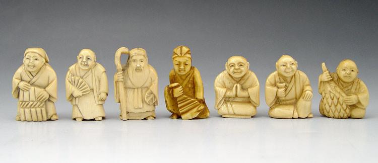 Appraisal: PIECE CARVED IVORY NETSUKES male figures all signed Largest ''