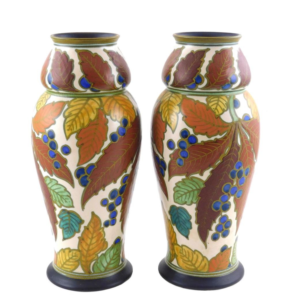 Appraisal: ART POTTERY Gouda matching pair of tall vases from the