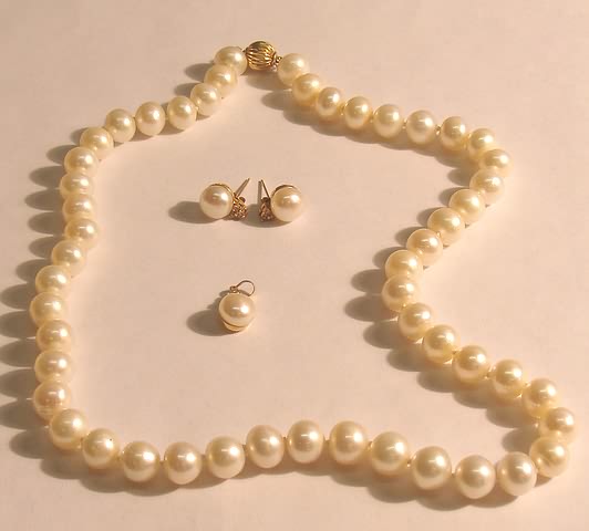 Appraisal: KY long strand of irregularly shaped mm pearls pendant and